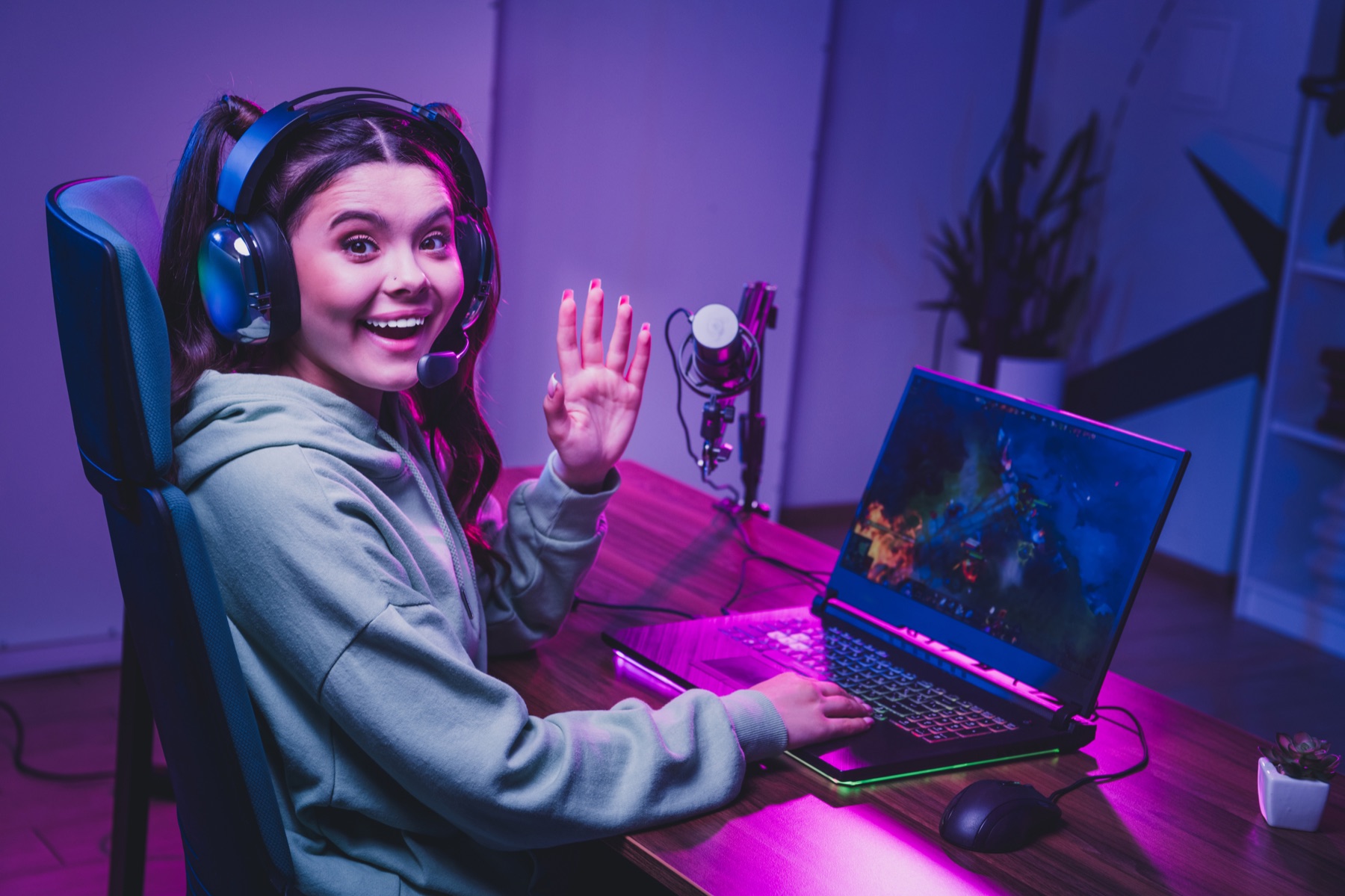 A gaming content creator streaming from her home setup